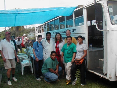 Belmopan Huaman Society (Mobile Bus) Belmopan Human Society early days. Goup of Member standing infront of Humane society first mobile bus.