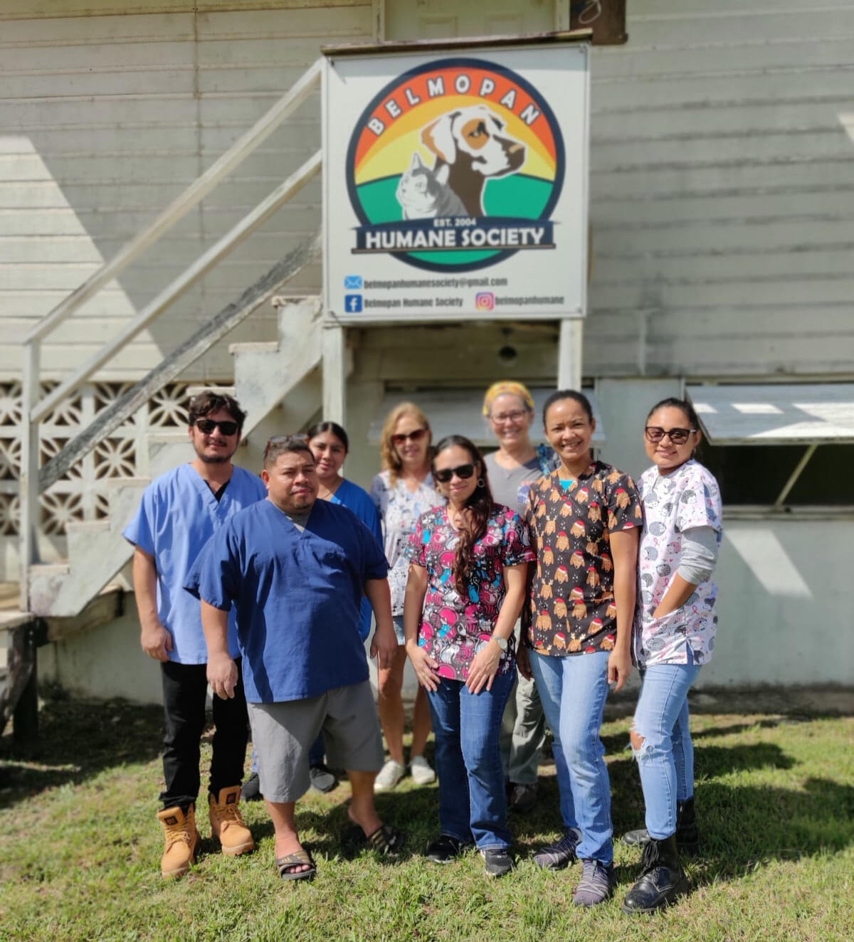 Our Story Picture Members of Belmopan Humane Society, standing infront of the BHS Center in Belmopan